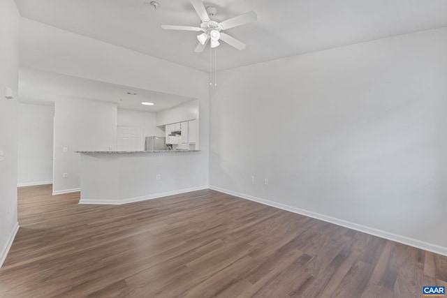 945 Dorchester Pl Unit 306, Charlottesville, VA 22911 - unfurnished living room featuring ceiling fan and dark wood-style flooring