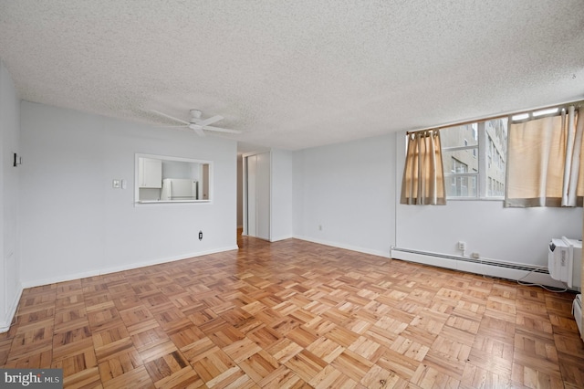 1030 E Lancaster Ave Unit 806, Bryn Mawr, PA 19010 - spare room with baseboard heating, ceiling fan, and a textured ceiling