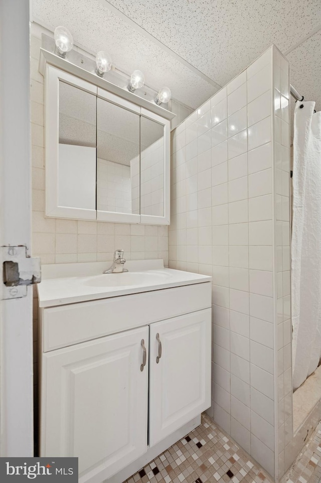 1030 E Lancaster Ave Unit 806, Bryn Mawr, PA 19010 - bathroom with tile walls, vanity, and a tile shower