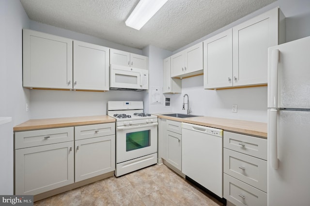 1030 E Lancaster Ave Unit 806, Bryn Mawr, PA 19010 - kitchen featuring white appliances, wood counters, a textured ceiling, and white cabinets