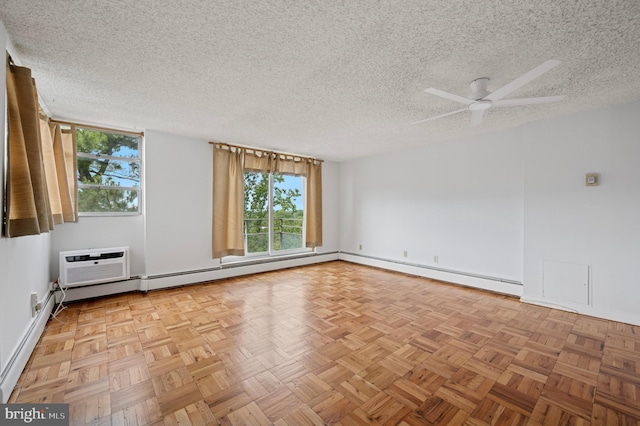 1030 E Lancaster Ave Unit 806, Bryn Mawr, PA 19010 - spare room featuring healthy amount of natural light, a textured ceiling, a baseboard heating unit, ceiling fan, and a wall mounted air conditioner