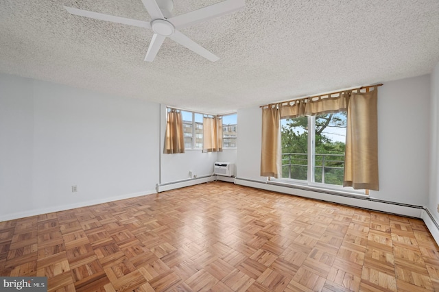 1030 E Lancaster Ave Unit 806, Bryn Mawr, PA 19010 - empty room with a baseboard radiator, a textured ceiling, a ceiling fan, and an AC wall unit