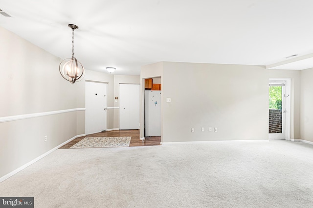 19 Juliet Ln Unit 103, Baltimore, MD 21236 - empty room with carpet floors and a chandelier