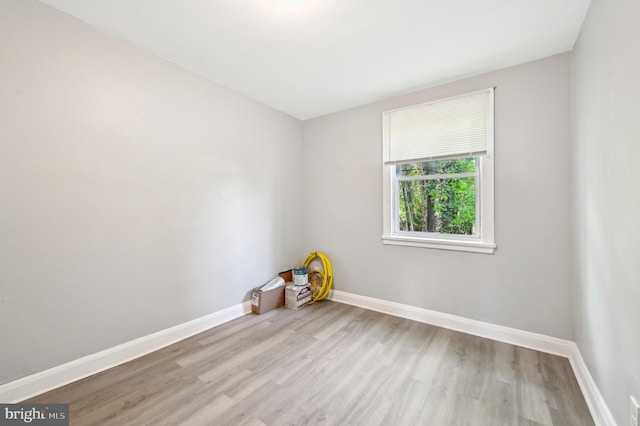 1126 Gleneagle Rd, Baltimore, MD 21239 - empty room with wood finished floors and baseboards