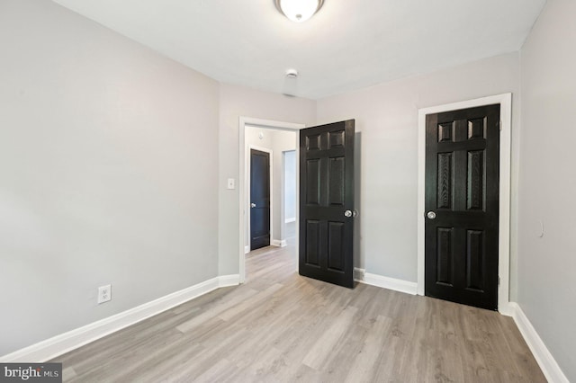 1126 Gleneagle Rd, Baltimore, MD 21239 - unfurnished bedroom featuring light wood-style floors and baseboards