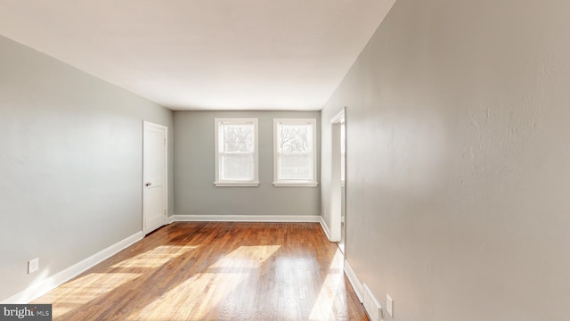 1126 Gleneagle Rd, Baltimore, MD 21239 - empty room featuring wood finished floors and baseboards