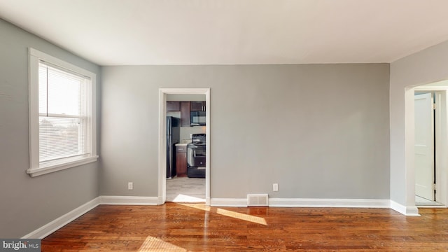 1126 Gleneagle Rd, Baltimore, MD 21239 - spare room featuring wood finished floors and baseboards