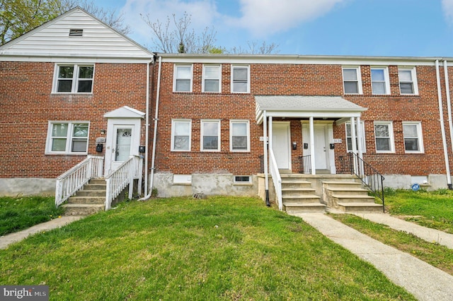 1126 Gleneagle Rd, Baltimore, MD 21239 - townhome / multi-family property featuring brick siding and a front yard