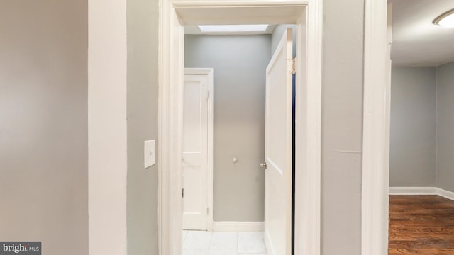 1126 Gleneagle Rd, Baltimore, MD 21239 - corridor with baseboards and wood finished floors