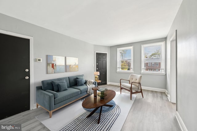 1126 Gleneagle Rd, Baltimore, MD 21239 - living room with light wood-type flooring and baseboards