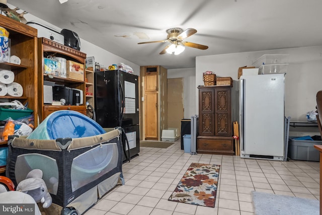 65 Silverspruce Rd, Levittown, PA 19056 - bedroom with freestanding refrigerator and light tile patterned flooring