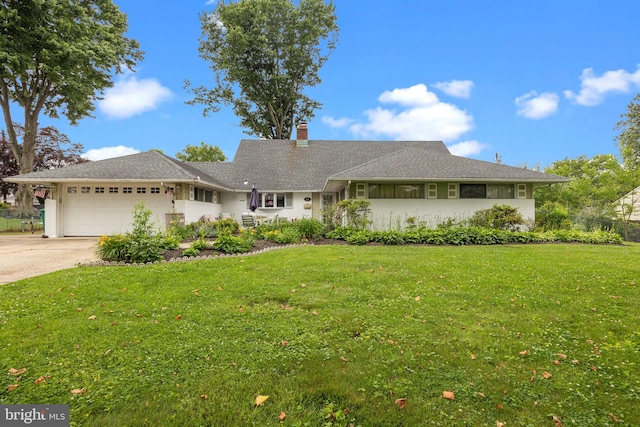 65 Silverspruce Rd, Levittown, PA 19056 - view of front of home featuring an attached garage, concrete driveway, and a chimney