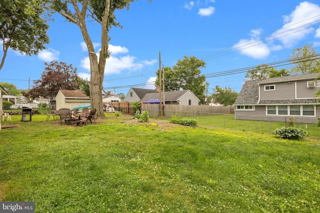 65 Silverspruce Rd, Levittown, PA 19056 - fenced backyard featuring a storage unit