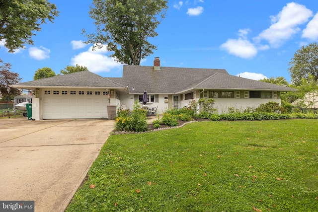 65 Silverspruce Rd, Levittown, PA 19056 - single story home with an attached garage, a chimney, driveway, and a front yard