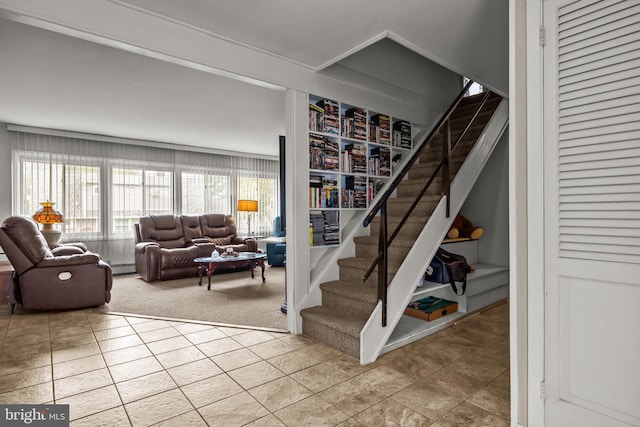 65 Silverspruce Rd, Levittown, PA 19056 - stairway featuring tile patterned flooring, a baseboard radiator, and carpet floors
