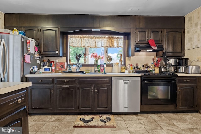 65 Silverspruce Rd, Levittown, PA 19056 - kitchen featuring appliances with stainless steel finishes, under cabinet range hood, light countertops, and dark brown cabinets