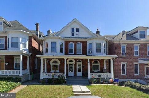 538 Summit Ave, Hagerstown, MD 21740 - townhome / multi-family property featuring a porch and a front lawn