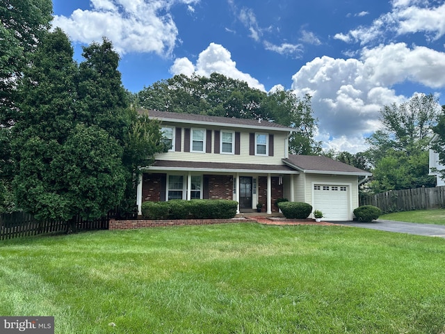 8953 Jasmine Ct, Manassas, VA 20110 - traditional-style home with driveway, an attached garage, and a porch