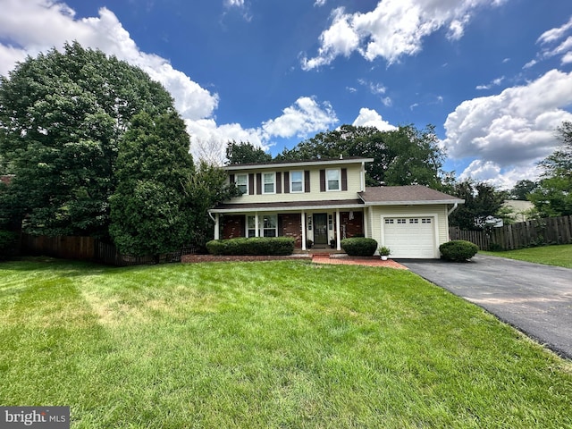 8953 Jasmine Ct, Manassas, VA 20110 - view of front of house with a garage, asphalt driveway, and a porch