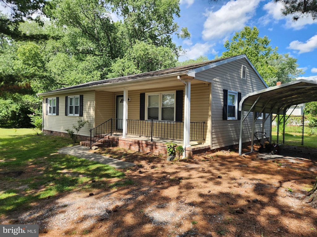 103 Montleau Ave, Salisbury, MD 21804 - view of front facade featuring a detached carport, covered porch, and a front lawn