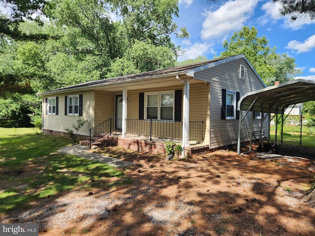 103 Montleau Ave, Salisbury, MD 21804 - view of front facade featuring a detached carport, covered porch, and a front lawn