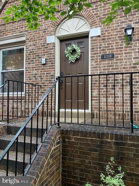 1120 N Taylor St Unit 2, Arlington, VA 22201 - view of exterior entry featuring brick siding