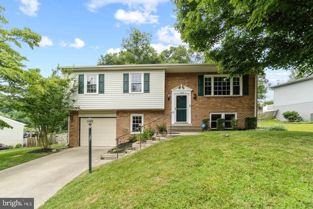 11876 Catoctin Dr, Woodbridge, VA 22192 - split foyer home featuring an attached garage, driveway, brick siding, and entry steps
