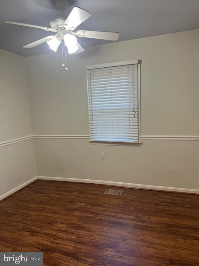 11876 Catoctin Dr, Woodbridge, VA 22192 - unfurnished room with wood finished floors and ceiling fan