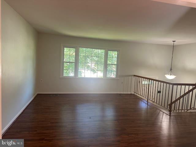 11876 Catoctin Dr, Woodbridge, VA 22192 - empty room featuring dark wood-style floors and baseboards