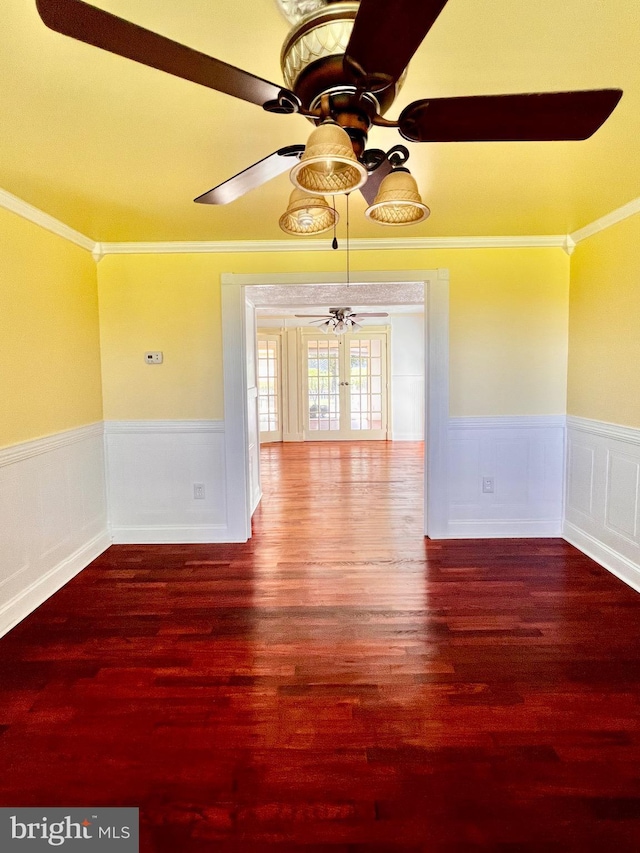 6535 Gravel Branch Rd, Hurlock, MD 21643 - spare room featuring a ceiling fan, wainscoting, wood finished floors, and ornamental molding