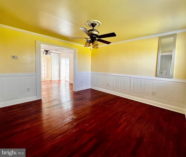 6535 Gravel Branch Rd, Hurlock, MD 21643 - spare room with ornamental molding, a ceiling fan, wood finished floors, and a wainscoted wall