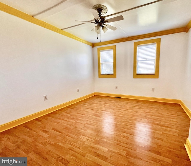 6535 Gravel Branch Rd, Hurlock, MD 21643 - spare room featuring crown molding, light wood-style flooring, and a ceiling fan