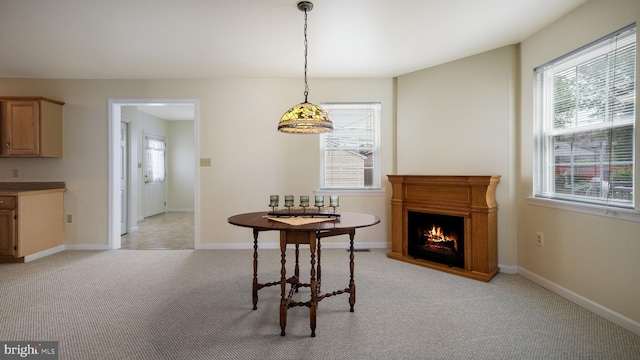 253 Roosevelt St, Bristol, PA 19007 - dining area with light carpet and a warm lit fireplace