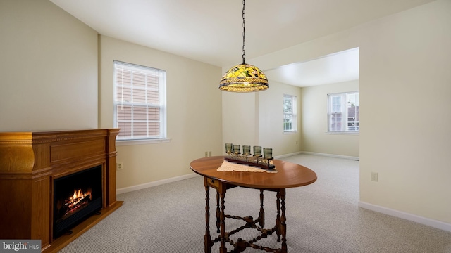 253 Roosevelt St, Bristol, PA 19007 - carpeted dining space with a warm lit fireplace and baseboards