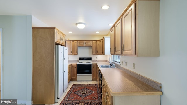 253 Roosevelt St, Bristol, PA 19007 - kitchen with white appliances, recessed lighting, light countertops, and light brown cabinetry