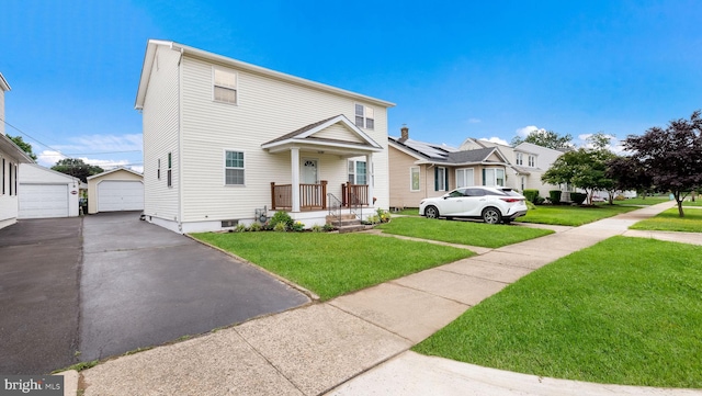 253 Roosevelt St, Bristol, PA 19007 - view of front of house with a front lawn, a garage, and an outbuilding