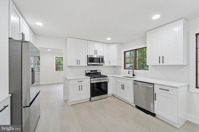 932 Cropwell Rd, Cherry Hill, NJ 08003 - kitchen featuring stainless steel appliances, light wood-style flooring, white cabinetry, and recessed lighting