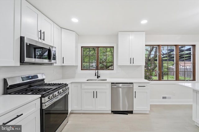 932 Cropwell Rd, Cherry Hill, NJ 08003 - kitchen featuring appliances with stainless steel finishes, white cabinetry, light countertops, recessed lighting, and tasteful backsplash