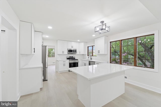 932 Cropwell Rd, Cherry Hill, NJ 08003 - kitchen featuring stainless steel appliances, light wood finished floors, white cabinetry, and recessed lighting