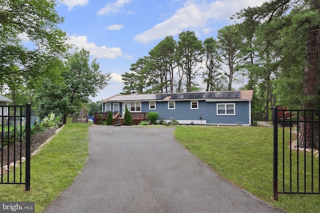 6 Shore Cir, Browns Mills, NJ 08015 - ranch-style home featuring asphalt driveway and roof mounted solar panels