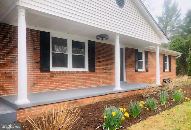7205 Silver Beech Ln, Warrenton, VA 20187 - property entrance featuring covered porch and brick siding