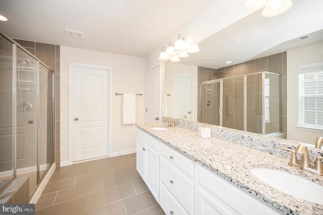 106 Pear Blossom Rd, Stafford, VA 22554 - bathroom with double vanity, a stall shower, and tile patterned flooring