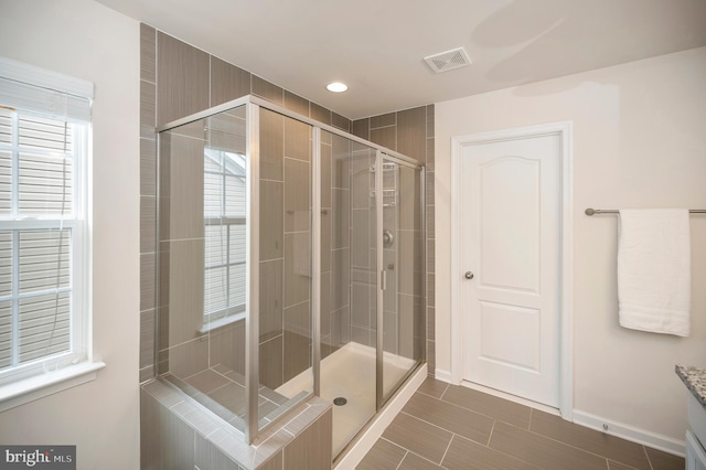 106 Pear Blossom Rd, Stafford, VA 22554 - full bath featuring a shower stall, vanity, plenty of natural light, and tile patterned flooring