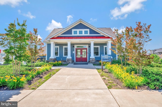 106 Pear Blossom Rd, Stafford, VA 22554 - craftsman-style house with french doors, covered porch, and a standing seam roof