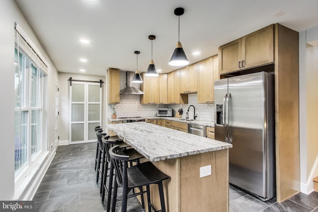 13000 Daley St, Silver Spring, MD 20906 - kitchen with stainless steel appliances, wall chimney exhaust hood, backsplash, a breakfast bar, and a center island