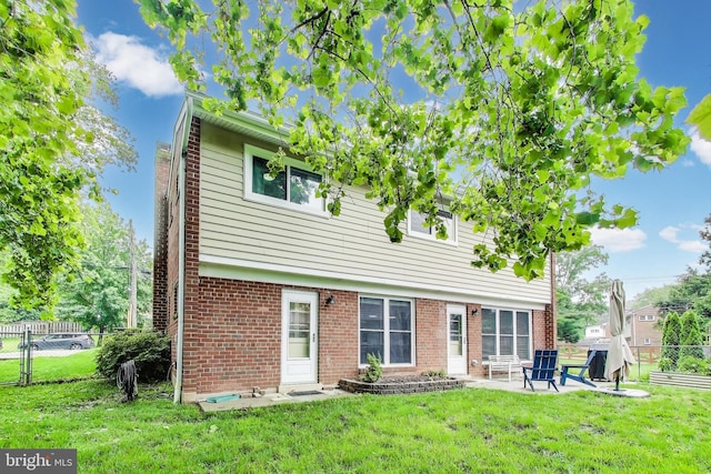 13000 Daley St, Silver Spring, MD 20906 - back of property featuring a patio area and brick siding