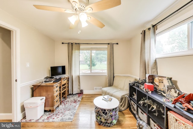 13000 Daley St, Silver Spring, MD 20906 - living area featuring wood finished floors and a ceiling fan
