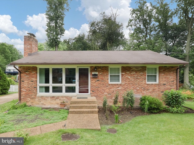 5415 Juliet St, Springfield, VA 22151 - ranch-style home with a chimney, brick siding, a front lawn, and a shingled roof