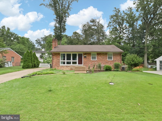 5415 Juliet St, Springfield, VA 22151 - view of front of home with a chimney, concrete driveway, and brick siding