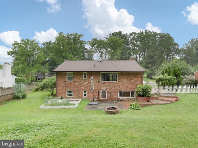 5415 Juliet St, Springfield, VA 22151 - back of house featuring a fire pit, brick siding, and a chimney